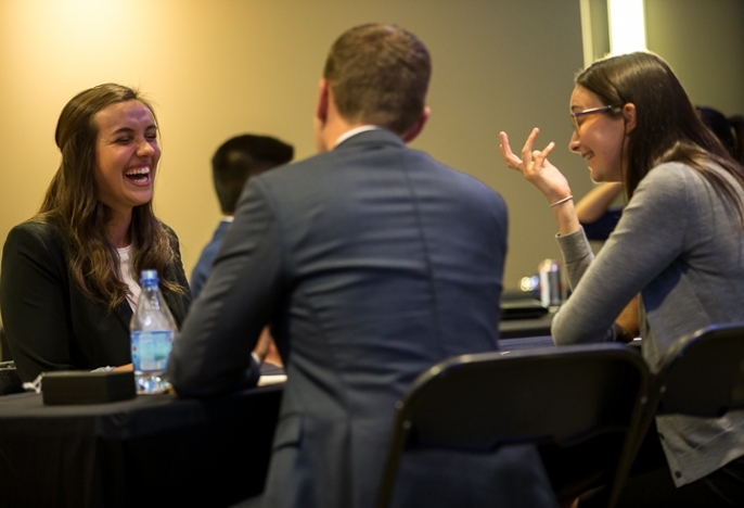 Speed networking student is enjoying the process of meeting with hiring companies.