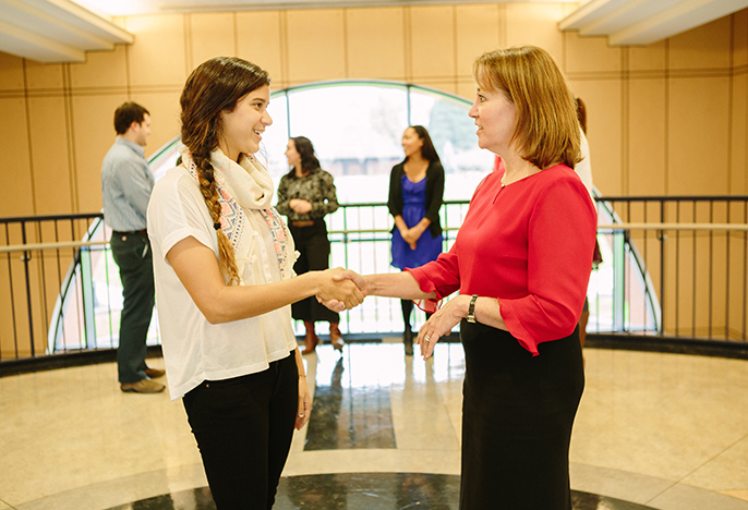 Student meets with a teacher